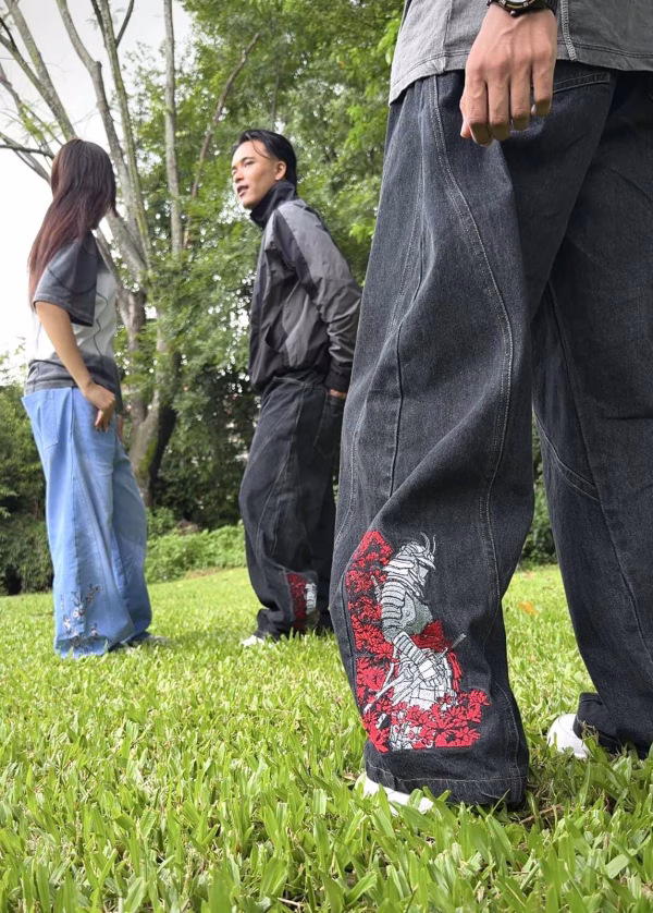 These aren't just jeans—they're a work of art.  - Our Super Baggy Samurai Jeans feature 200K+ precision embroidery stitches, showcasing a striking Samurai design with Cherry & Sakura Blossoms.